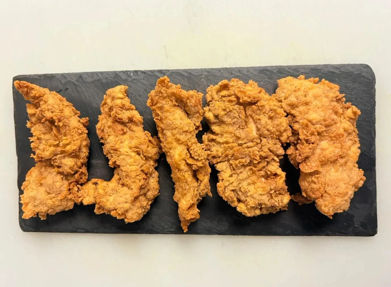 Crispy chicken tenders with dipping sauces at Wing Crafters London Ontario