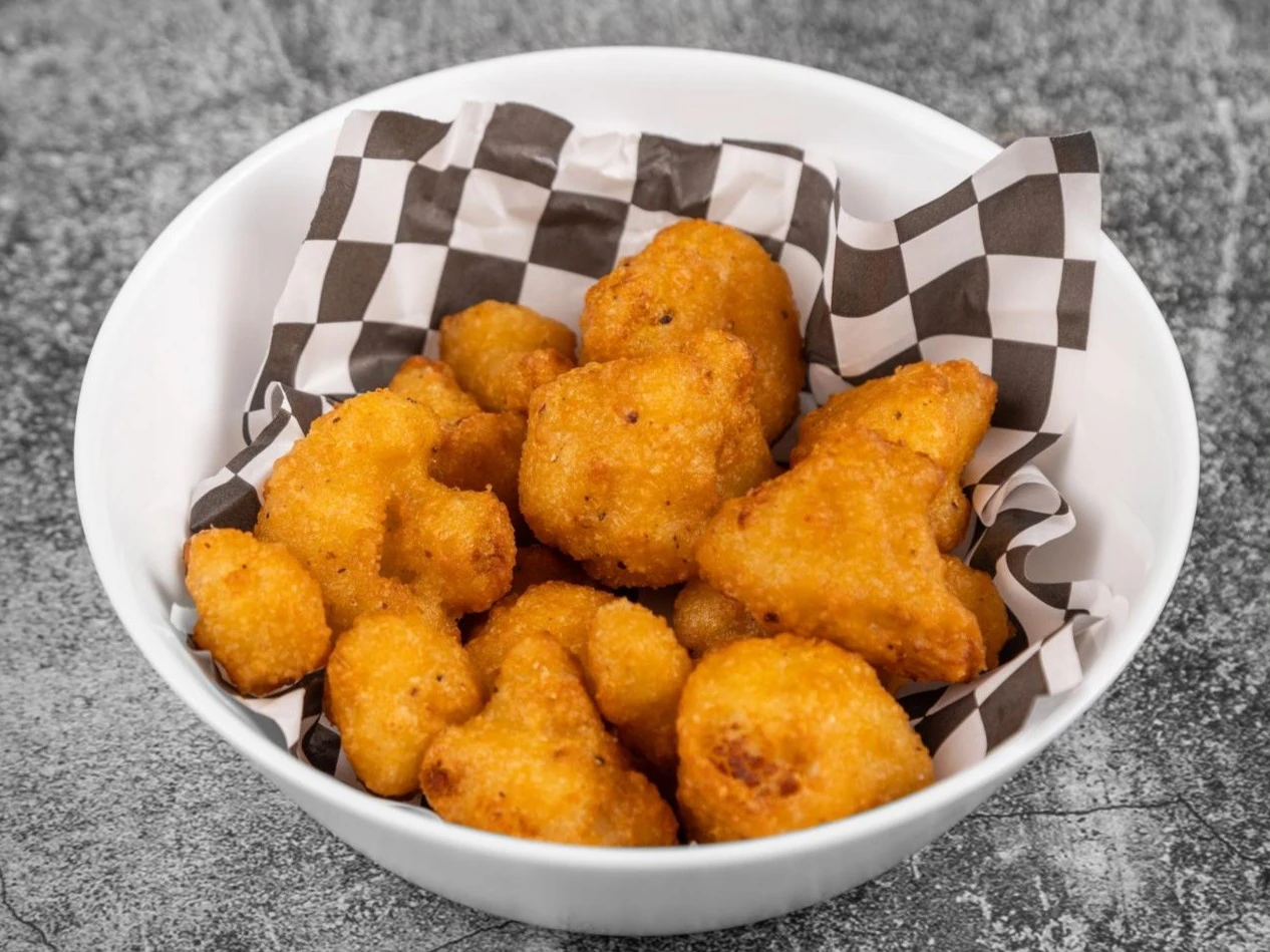 Crispy cauliflower bites tossed in house sauces at Wing Crafters in London, ON