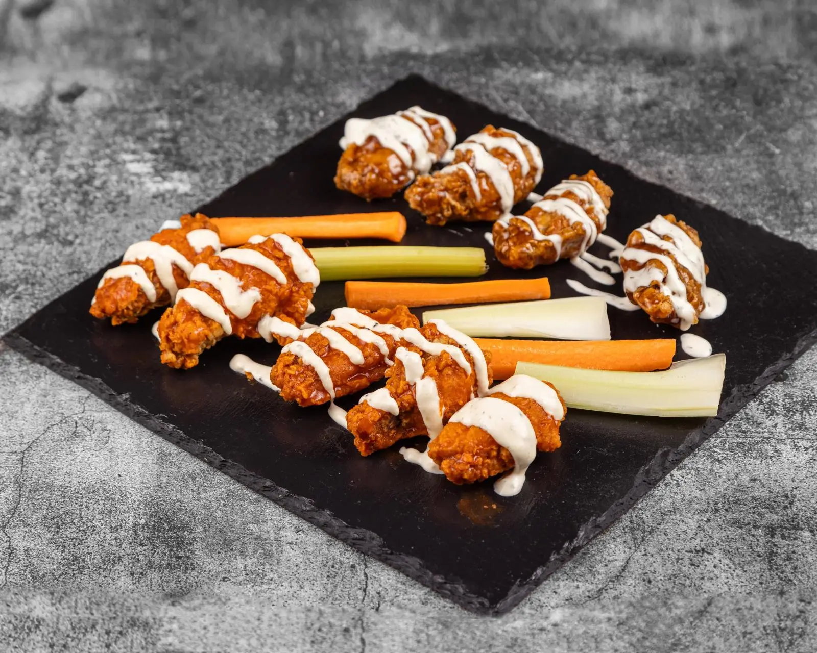 Classic chicken wings with dipping sauces at Wing Crafters in London, ON